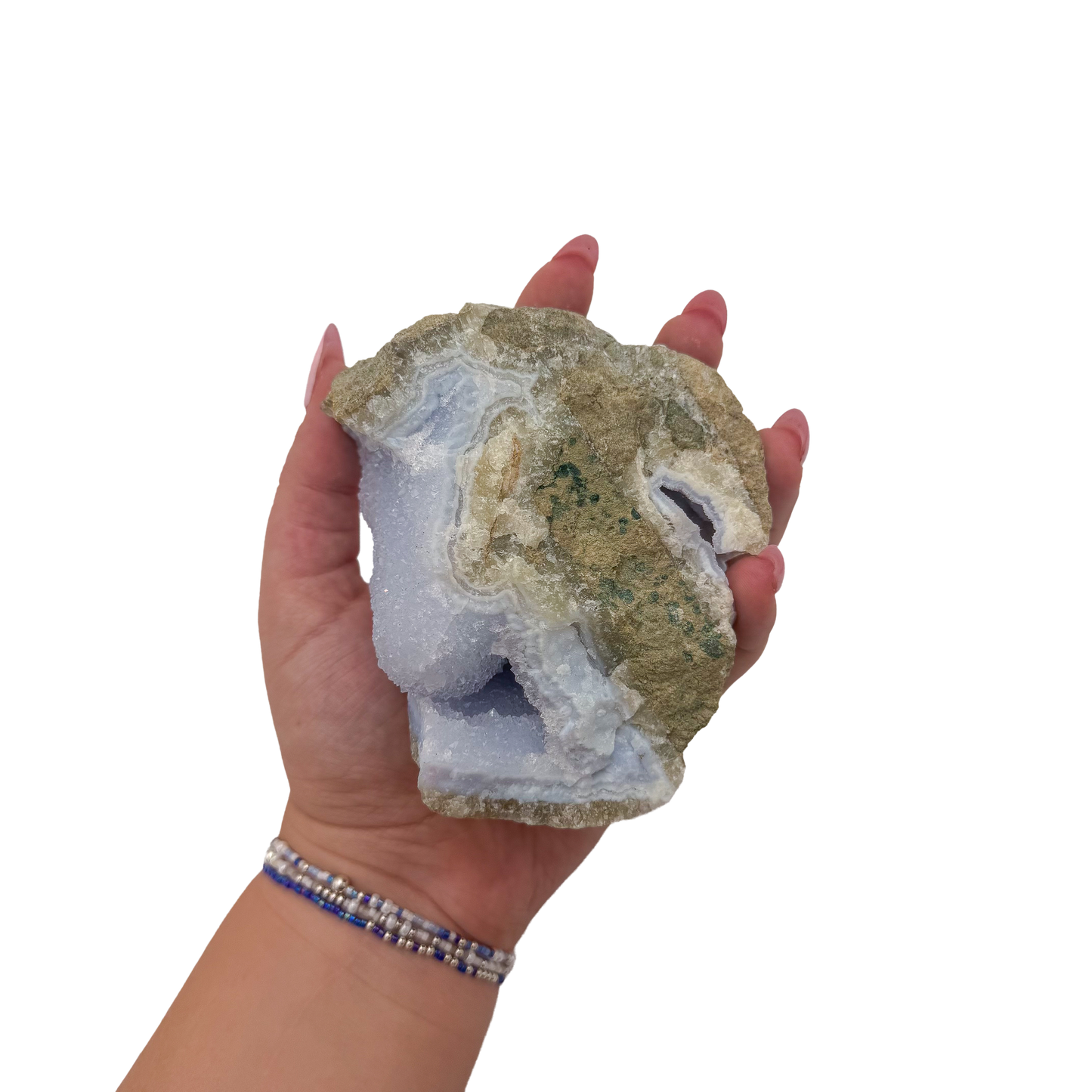 Blue lace agate raw geode held in hand to show scale
