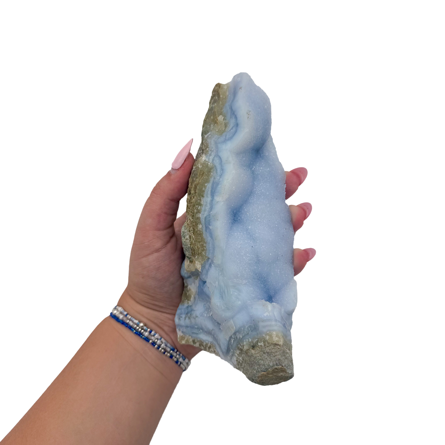 Blue lace agate raw geode held in hand to show scale