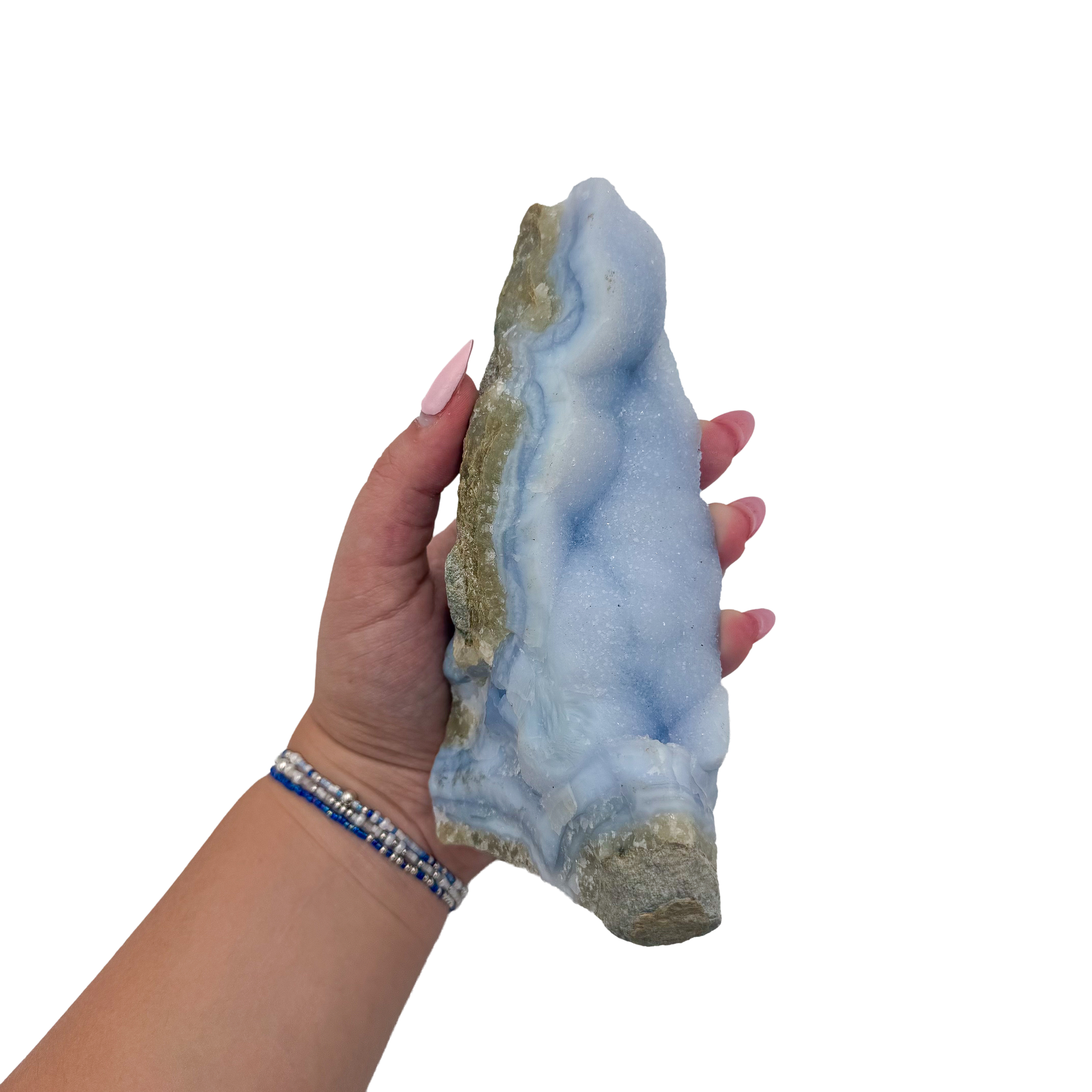 Blue lace agate raw geode held in hand to show scale