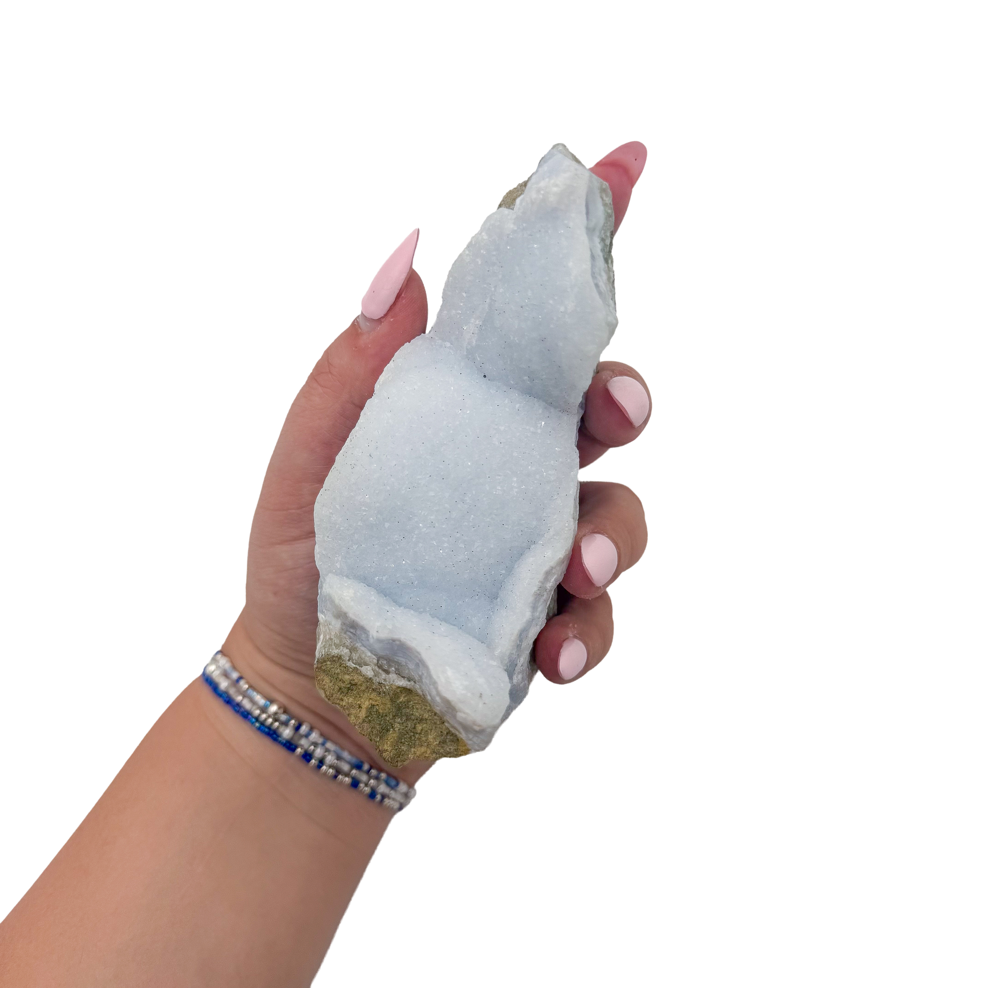 Blue lace agate raw geode held in hand to show scale