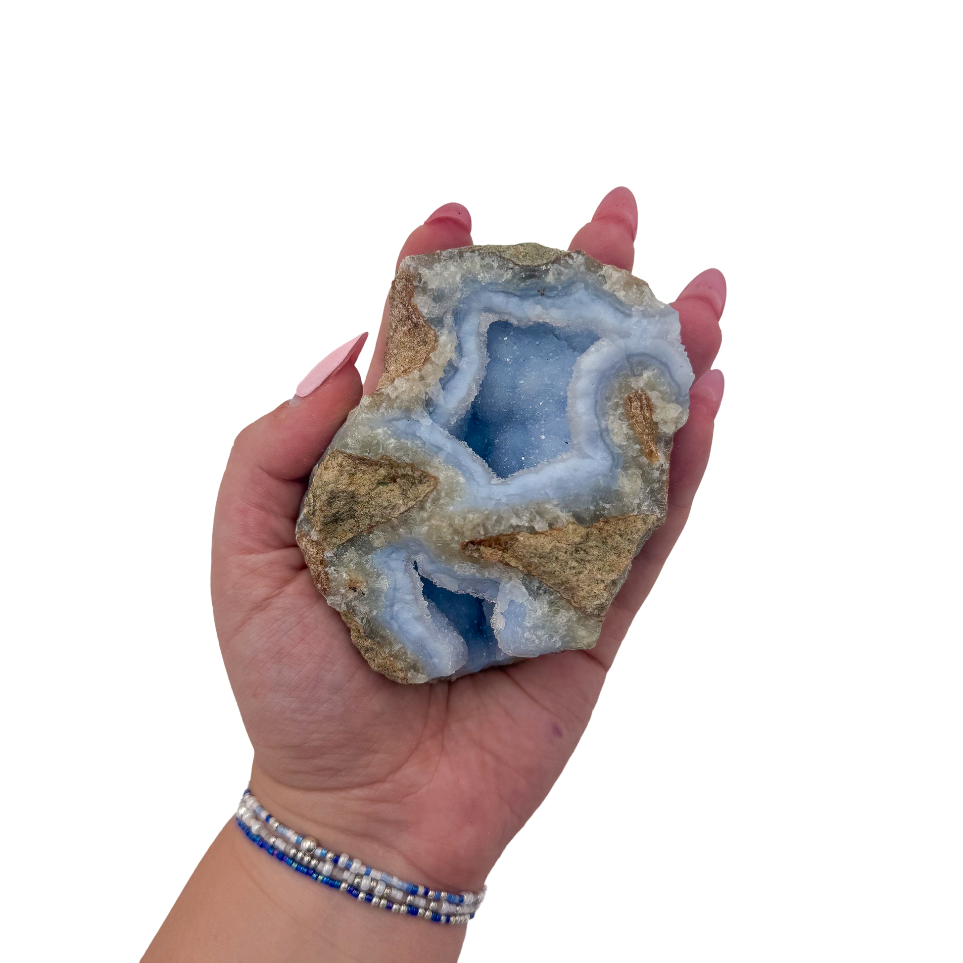 Blue lace agate raw geode held in hand to show scale
