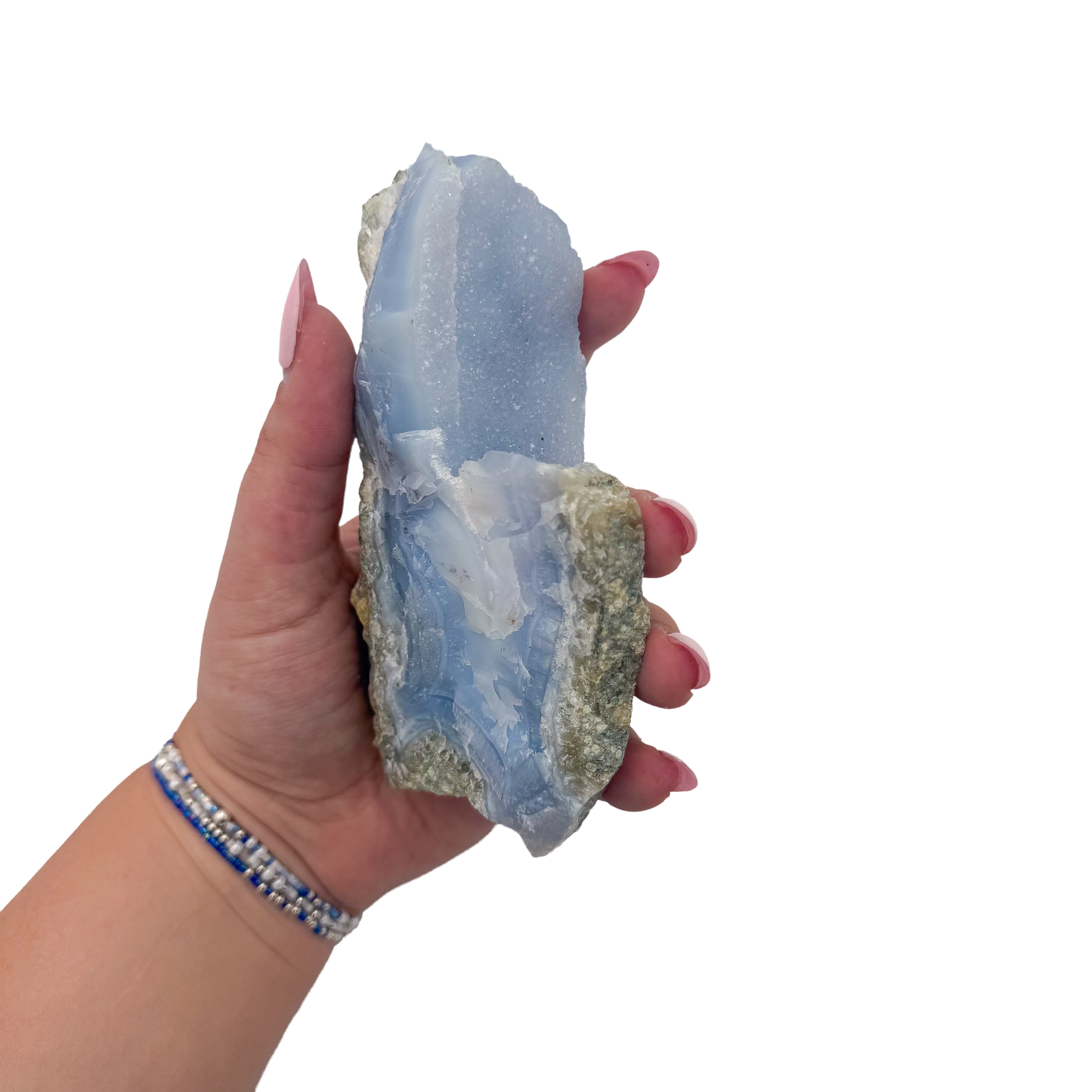 Blue lace agate raw geode held in hand to show scale