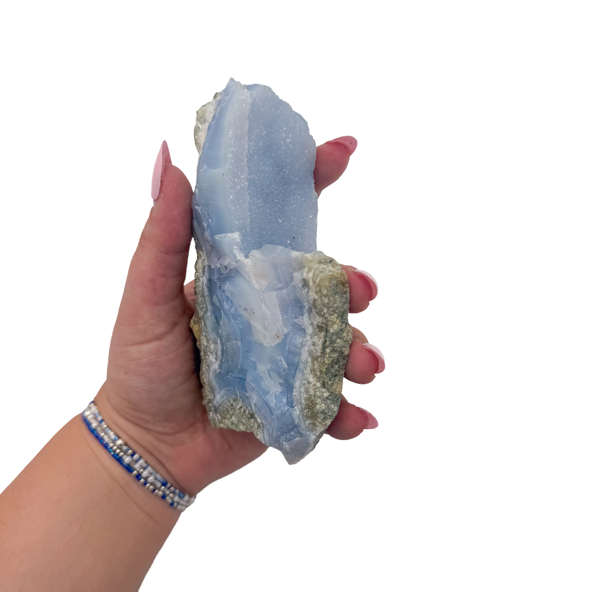 Blue lace agate raw geode held in hand to show scale