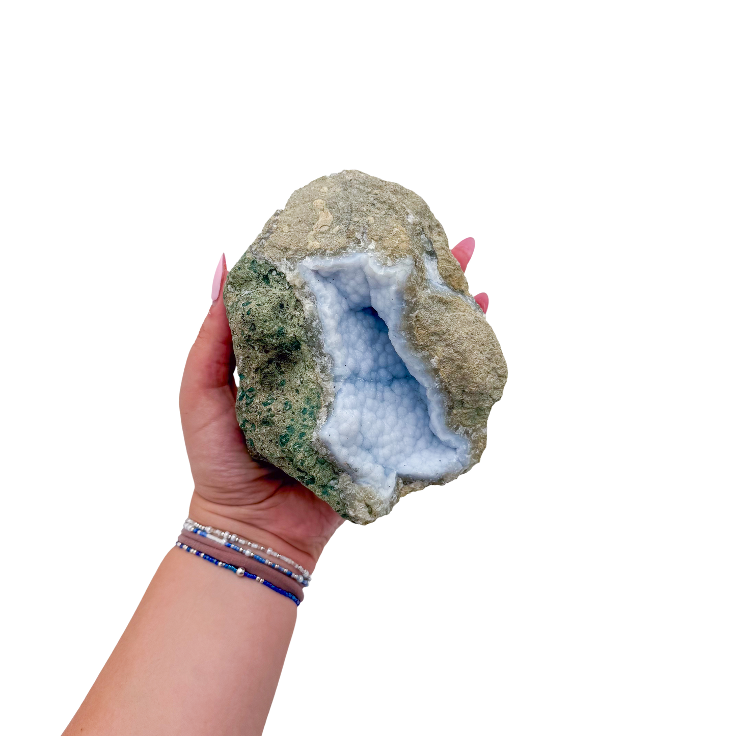 Blue lace agate raw geode held in hand to show scale
