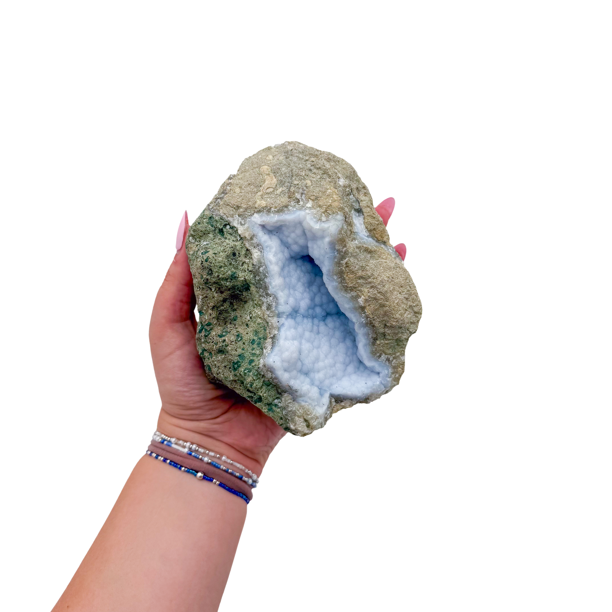 Blue lace agate raw geode held in hand to show scale
