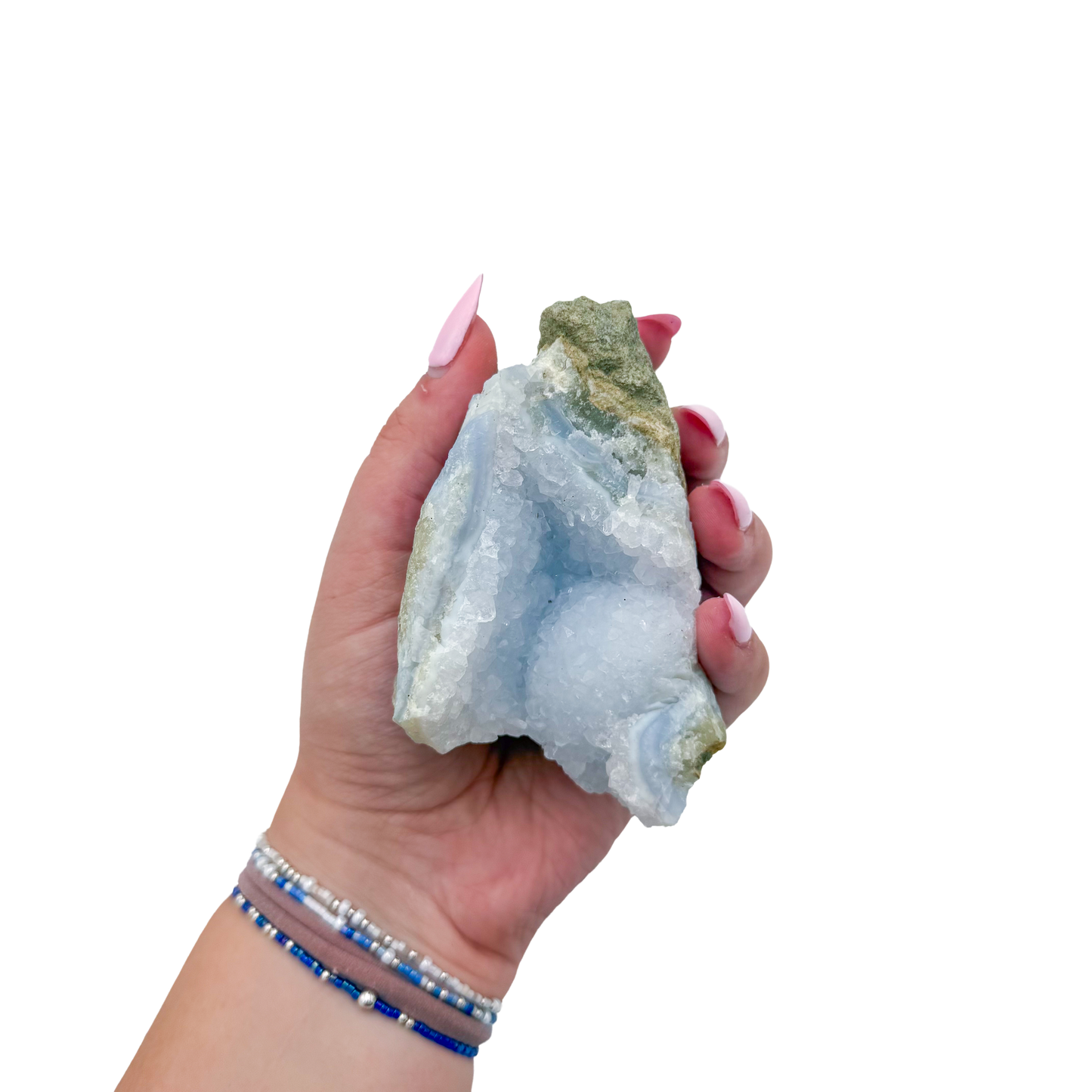 Blue lace agate raw geode held in hand to show scale
