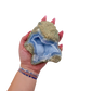 Blue lace agate raw geode held in hand to show scale