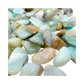 Top view of small Andean Blue Opal tumbled stones, AA grade Peru