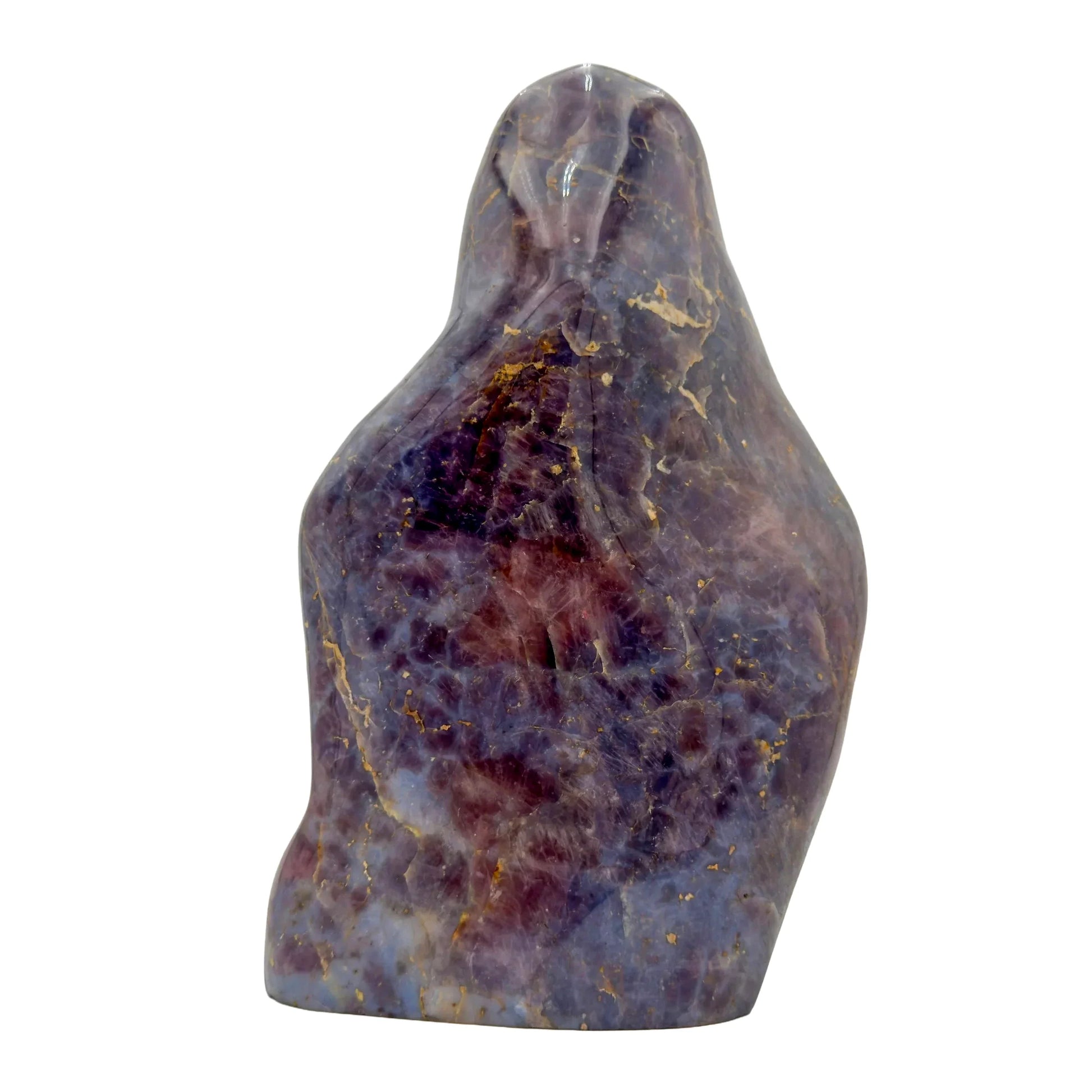 Natural light view of a Blue Rose Quartz freeform held against natural backdrop, sourced from Madagascar.