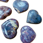 Grain detail of Blue Rose Quartz polished heart, showing color depth.