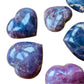 Side profile of Blue Rose Quartz polished heart, showing matte finish.