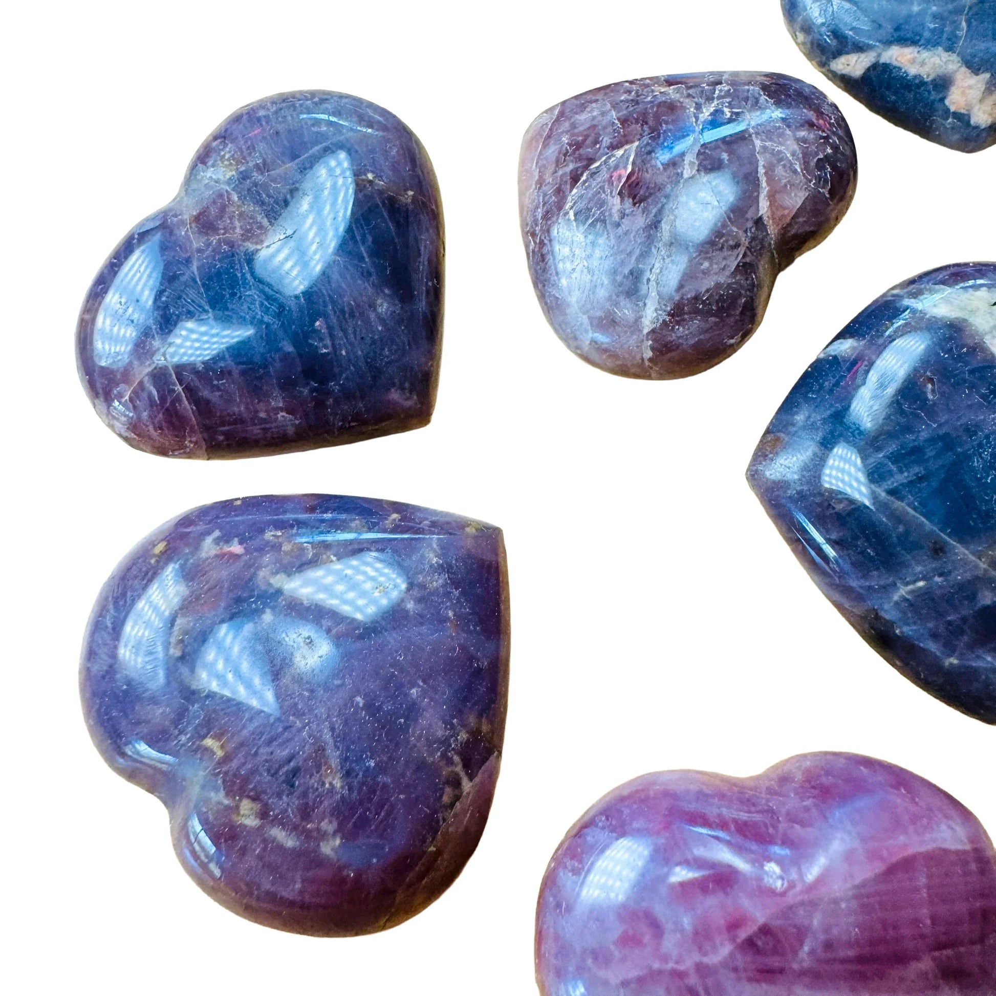 Side profile of Blue Rose Quartz polished heart, showing matte finish.