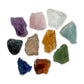Large Brazilian raw crystal set: ten rough stones including amethyst, rose quartz, clear quartz, black tourmaline and sodalite, together on white