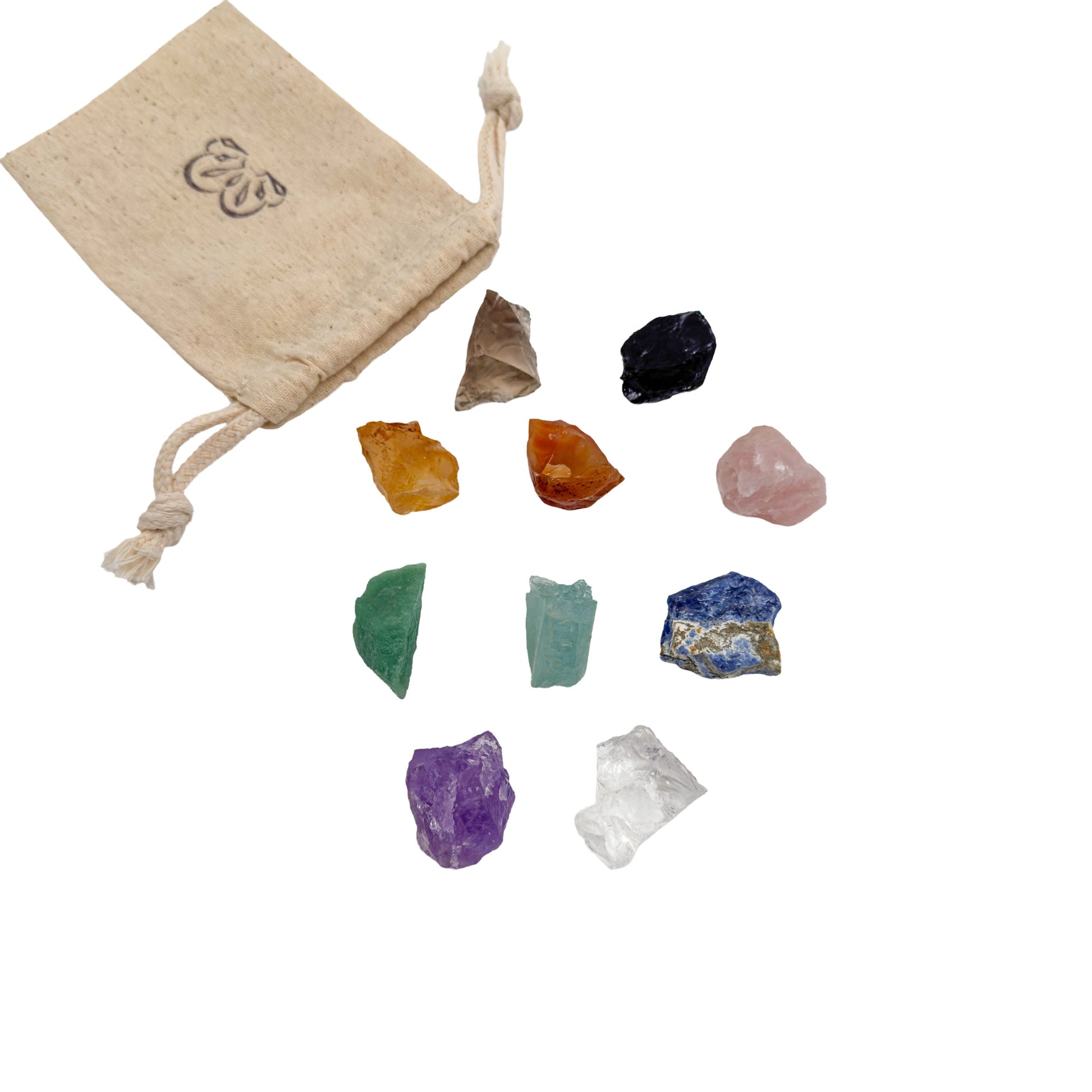 Brazilian raw crystal set with its reusable cotton bag, all ten rough stones laid out on white