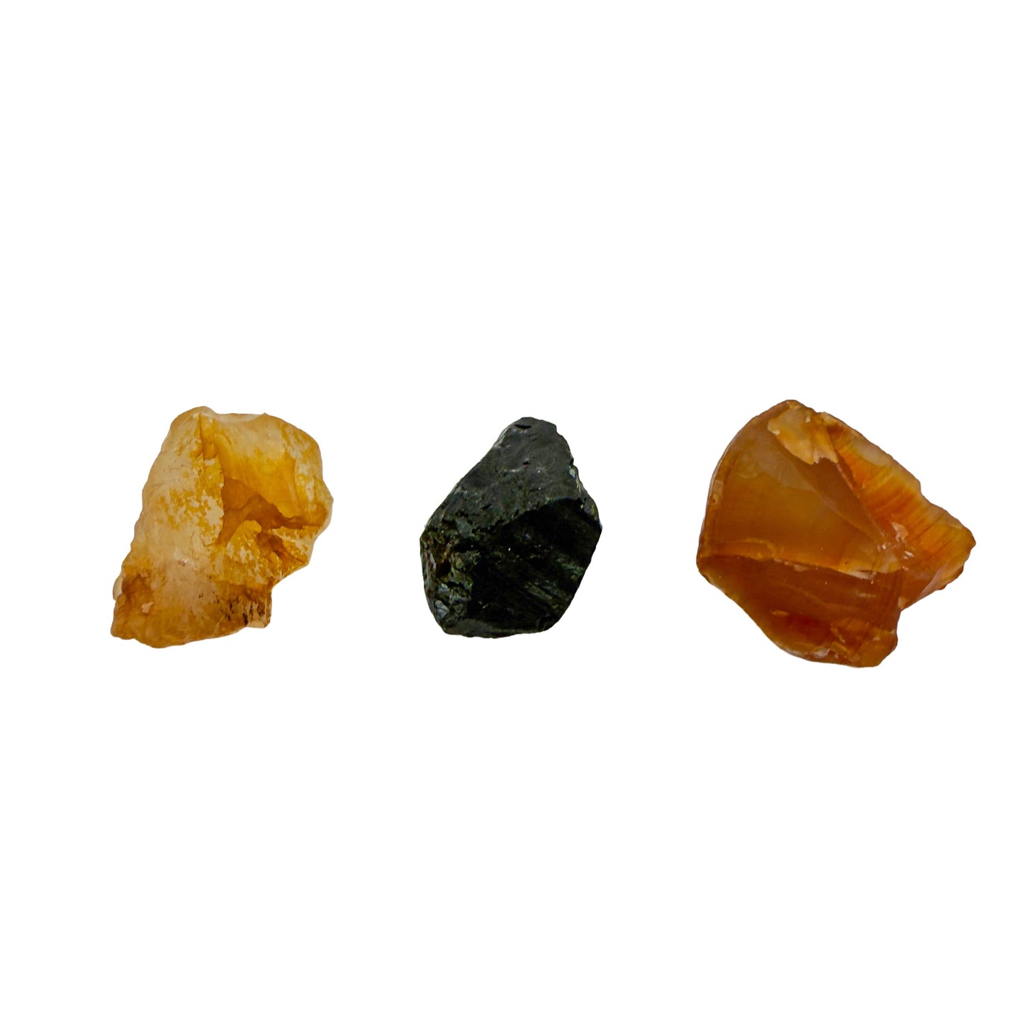 Close view of small raw golden healer, black tourmaline and carnelian from the Brazilian set