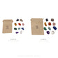 Both Brazilian tumbled stone sets beside the reusable cotton bag each one ships in