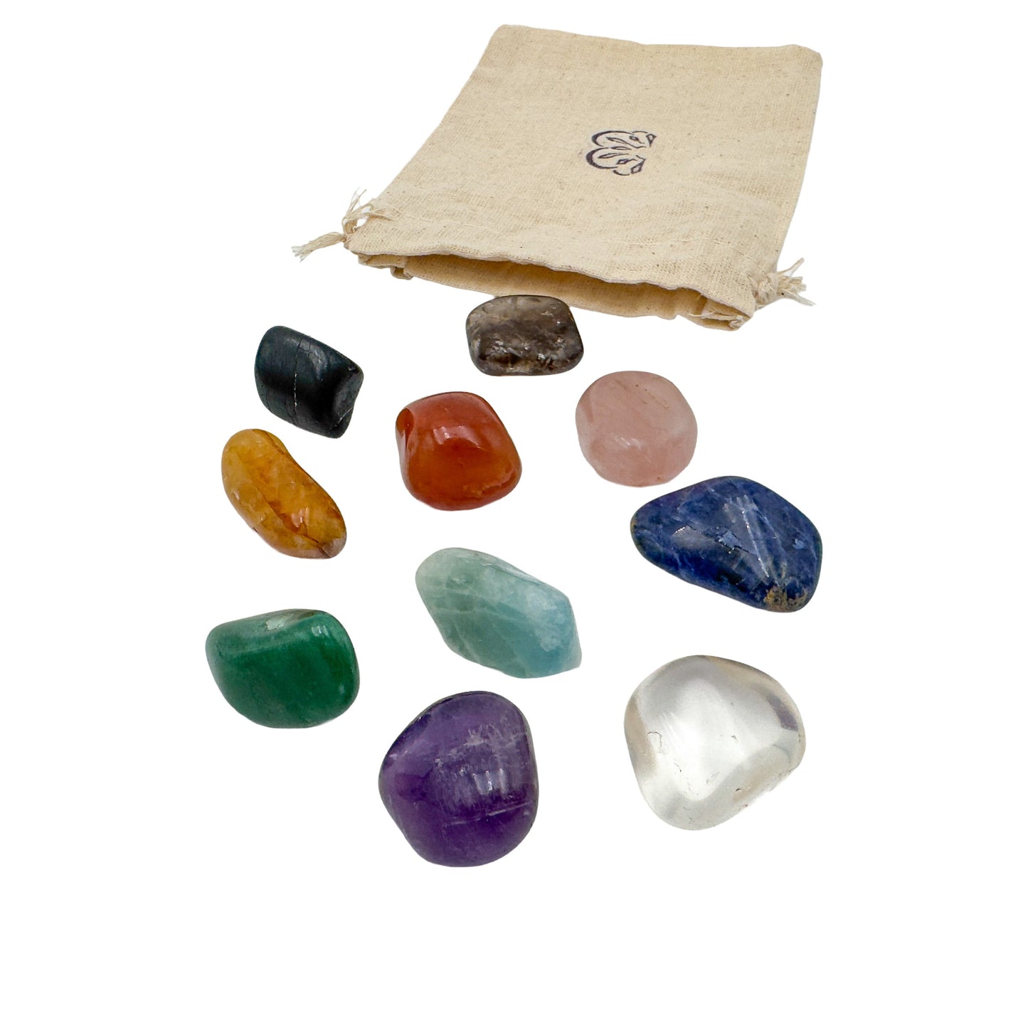 Brazilian tumbled stone set with its reusable cotton bag, all ten large crystals laid out on white