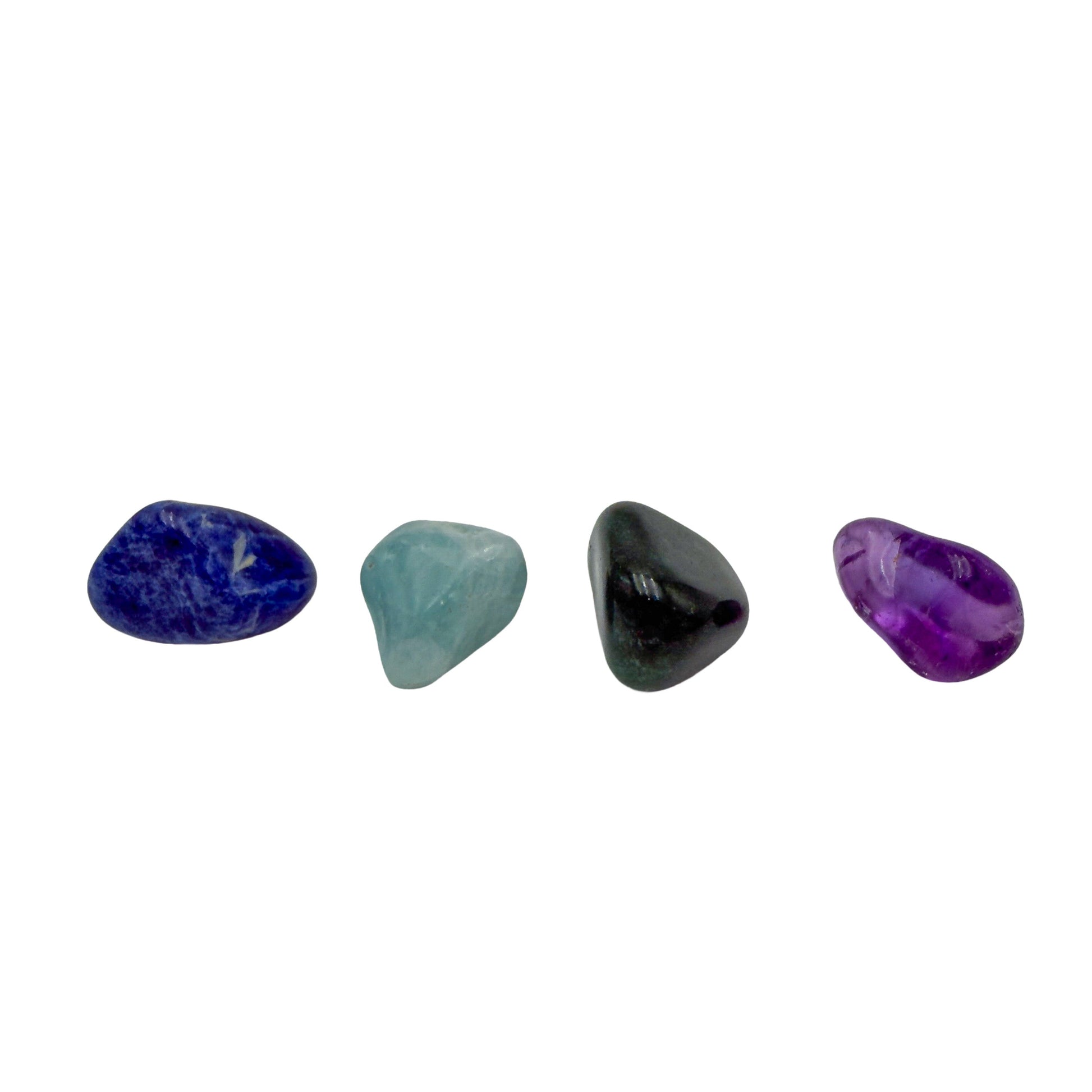 Close view of small tumbled sodalite, green aventurine, aquamarine and amethyst from the Brazilian set