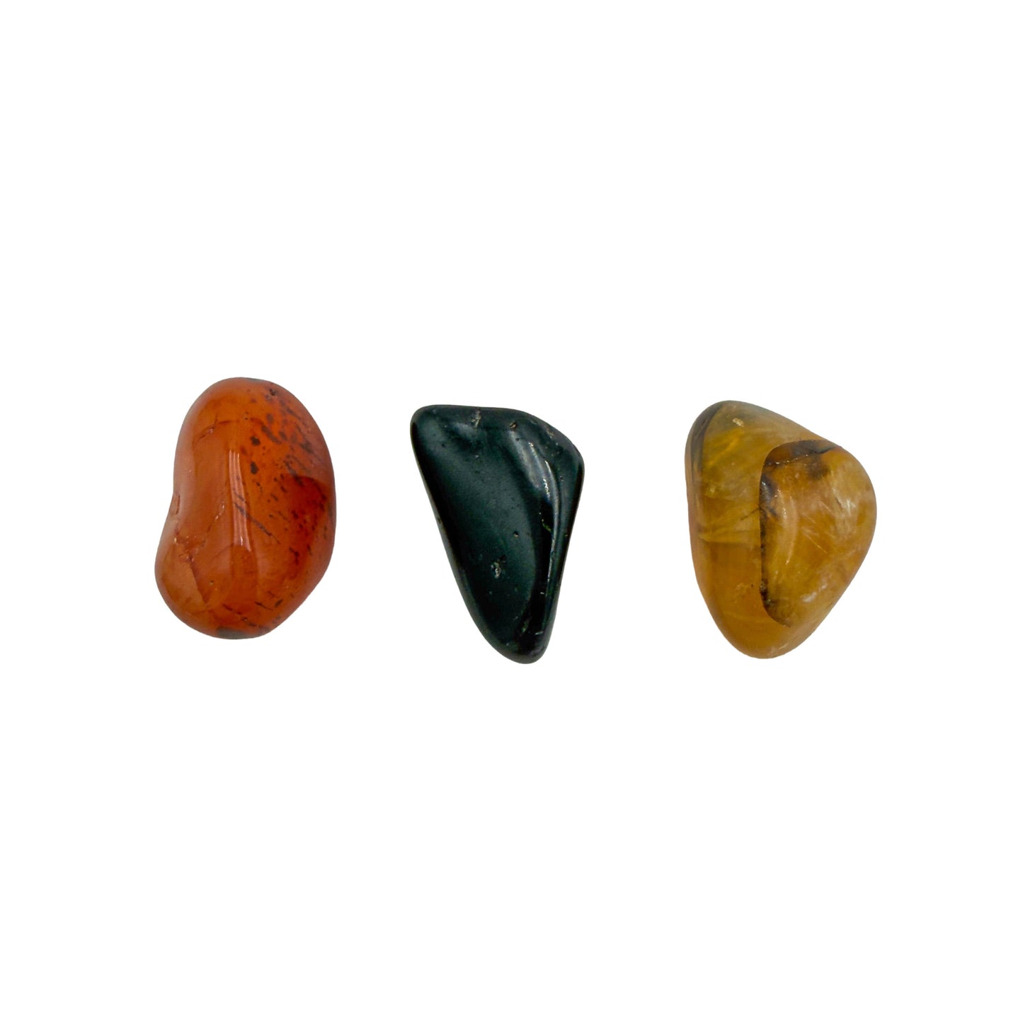 Small tumbled carnelian, black tourmaline and golden healer, second angle showing polished surfaces