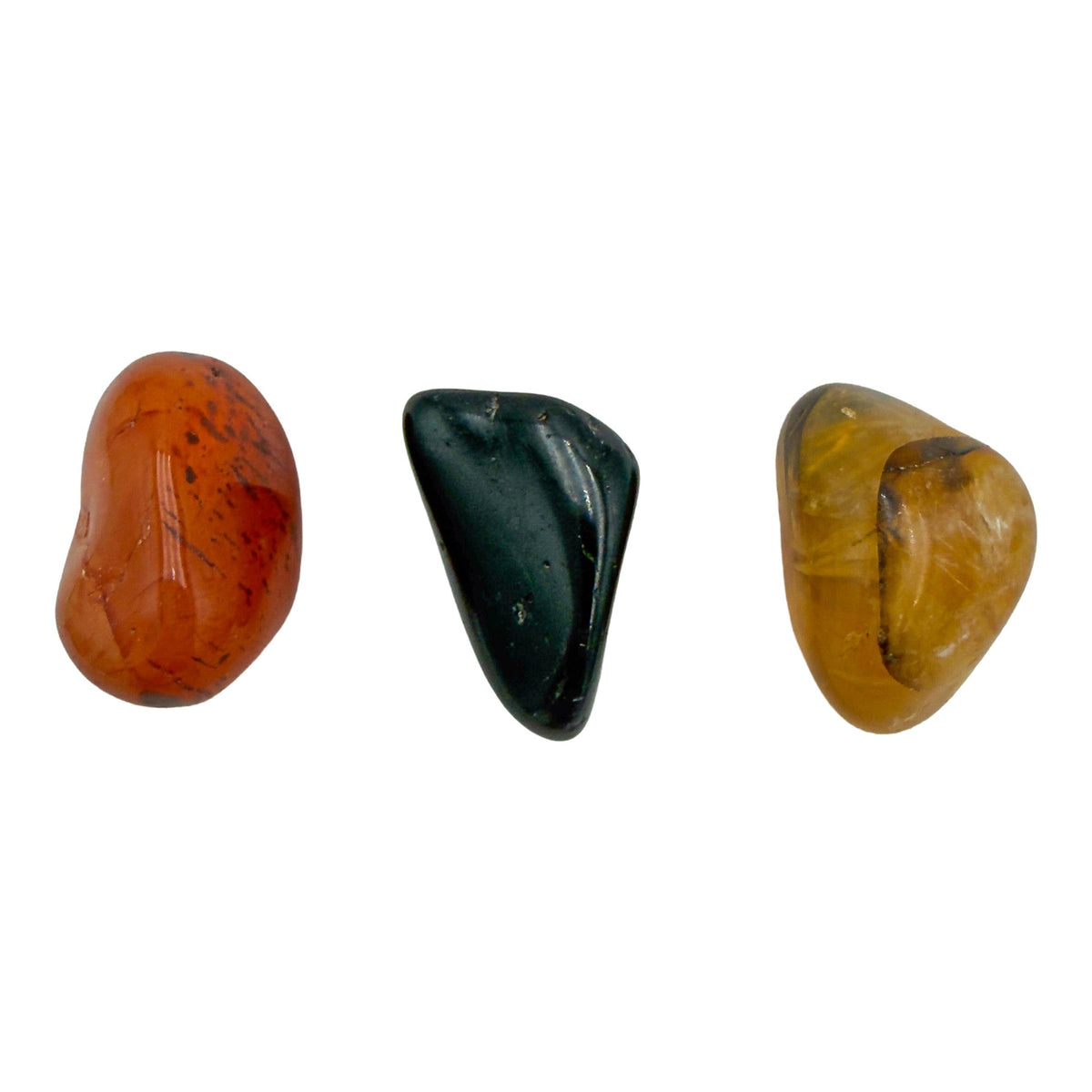 Small tumbled carnelian, black tourmaline and golden healer, second angle showing polished surfaces