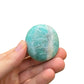 Detail shot of Grade A Amazonite palm stone under natural light