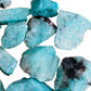 Hand-held view of a single Amazonite raw stone hand-selected from Amboasitra, Madagascar.