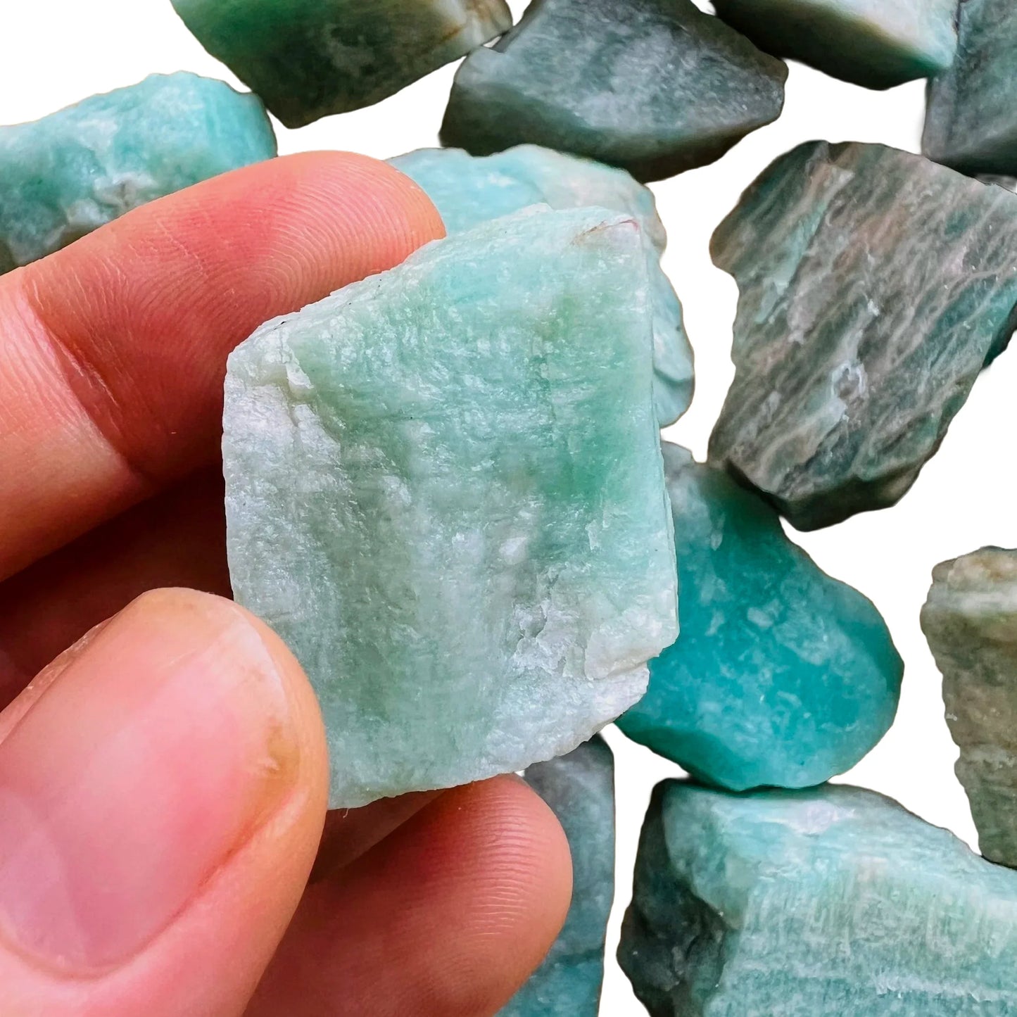 Grade a amazonite raw held in hand for size reference