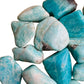 Side profile of Grade AA blue Amazonite tumbled stone, sourced from Madagascar, showing translucent edges.