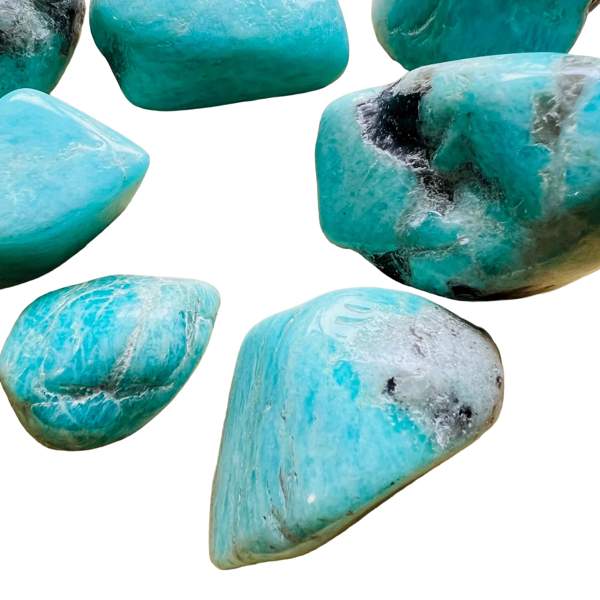 Natural light context of Amazonite tumbled stone, from Amboasitra, Madagascar, associated with Confidence, shown for shape and scale.