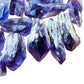 Side-on view of Grade AAA Amethyst raw point, from Brazil, showing tight grain.