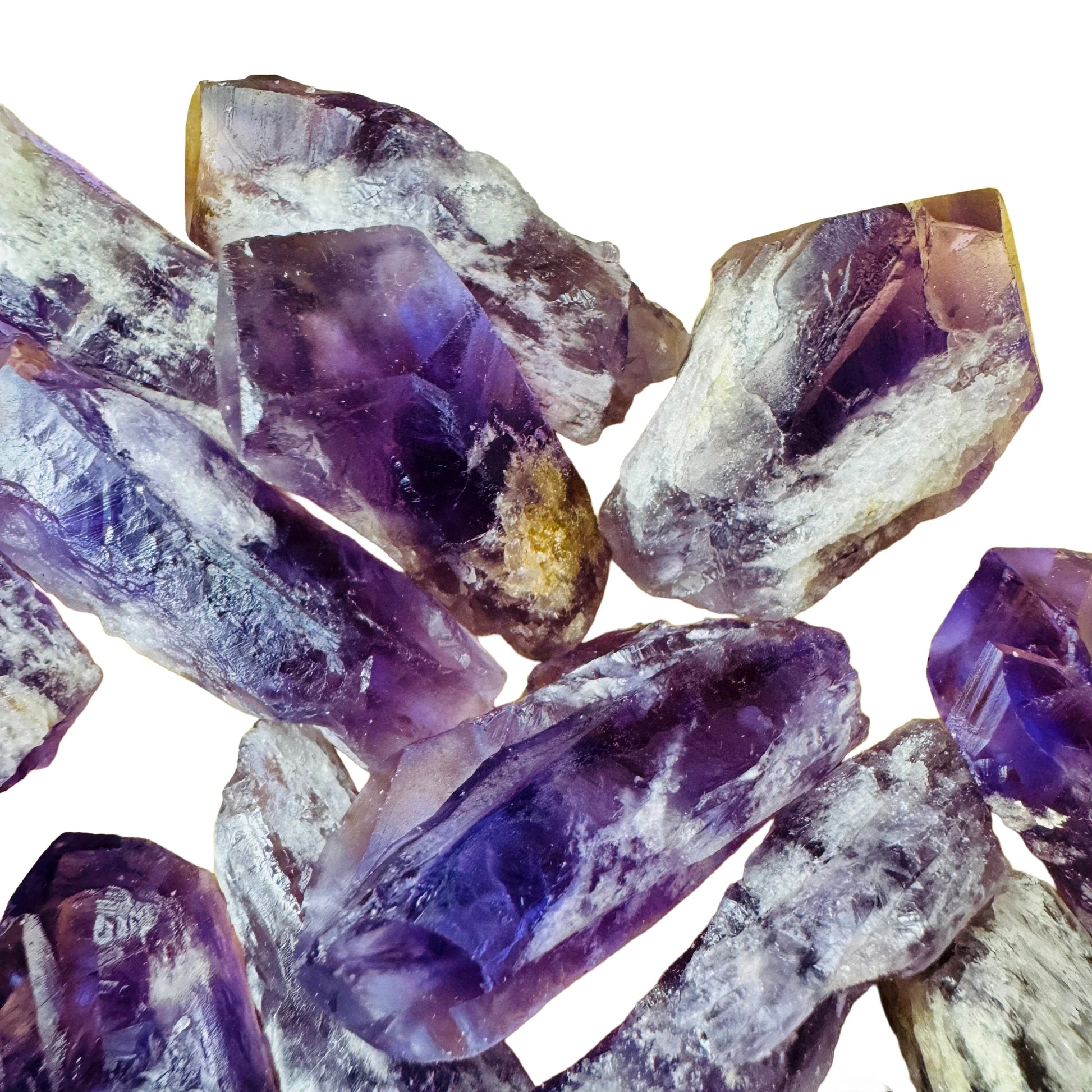 Grade aaa amethyst point held in hand for size reference