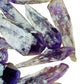 Side-on view of Amethyst raw point, sourced from Bahia, Brazil, traditionally used for Stress Relief and Sleep.