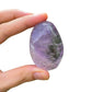 Macro view of Amethyst palm stone, showing matte finish, turned to for Stress Relief and Sleep.