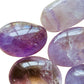 Daylight view of a Amethyst palm stone for Stress Relief.