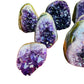 Profile view of Amethyst raw geode, often paired with practices around Stress Relief and Sleep, sourced from Artigas, Uruguay.