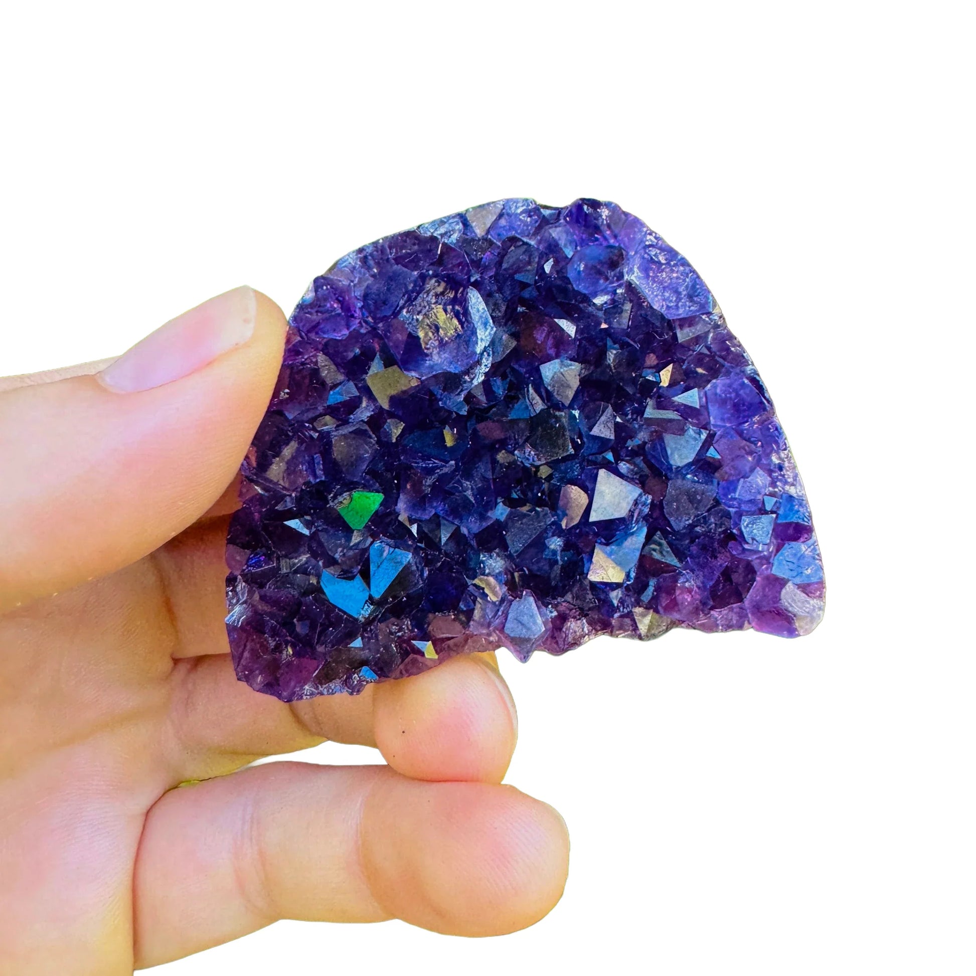 Grade aa amethyst geode held in hand for size reference