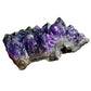 Grade aaa amethyst cluster held in hand for size reference