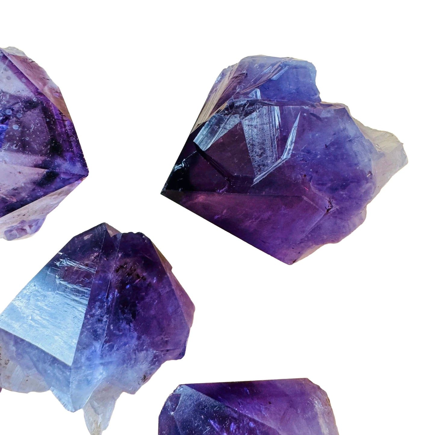Grade aaa amethyst point held in hand for size reference