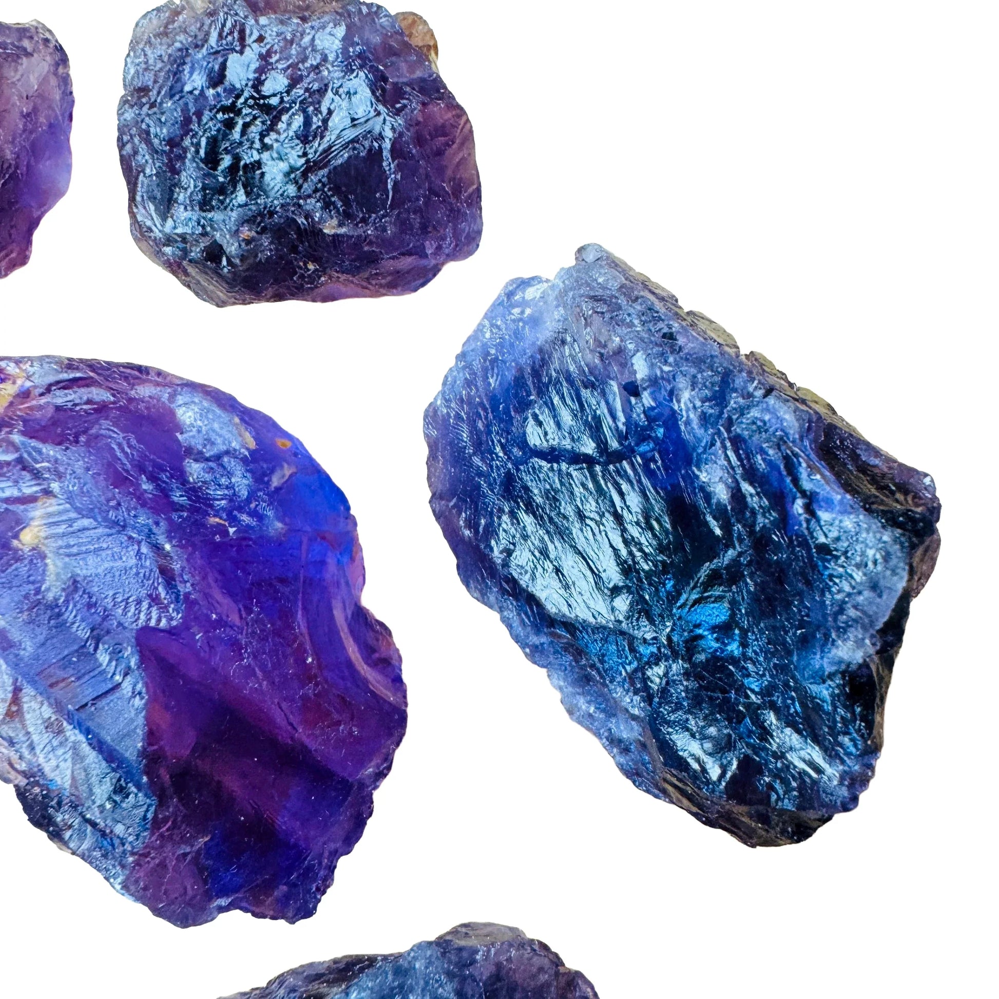 Lifestyle view of a Amethyst raw stone held against natural backdrop, hand-selected from Rio Grande do Sul, Brazil.