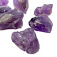 In-hand view of a Amethyst raw stone, sourced from Brazil.
