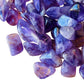 Rear view of Amethyst tumbled stone, hand-selected from Analamanga, Madagascar, showing earthy tone.