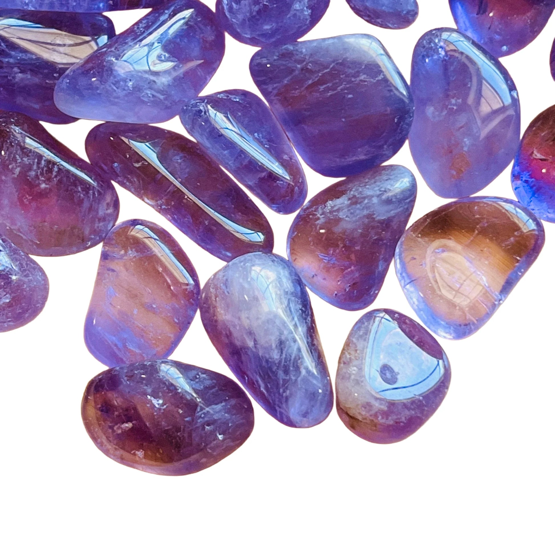 Edge-on view of Amethyst tumbled stone, hand-selected from Rio Grande do Sul, Brazil, kept near for Stress Relief.