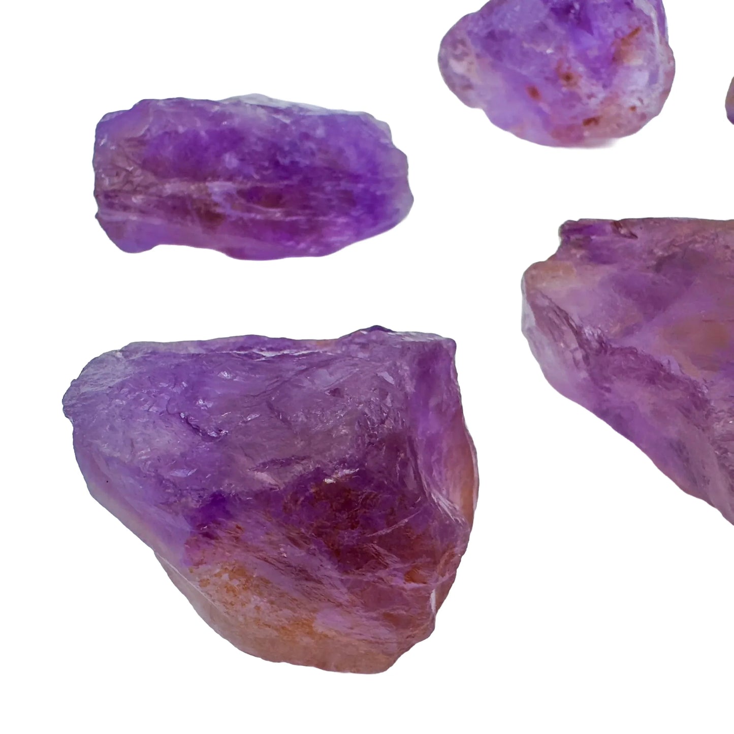 Grade aa ametrine raw held in hand for size reference