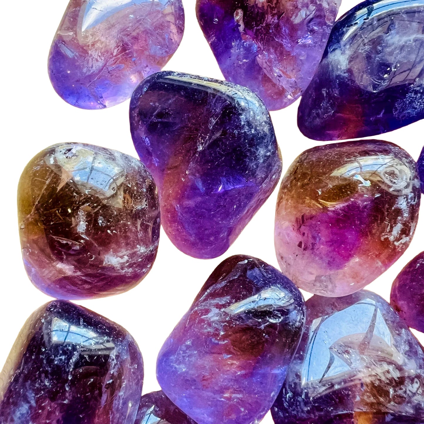 Color detail of Ametrine tumbled stone, carried for Focus and Manifestation, sourced from Bolivia.