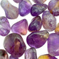 Top view of Ametrine tumbled stone, showing natural sheen, carried for Focus.