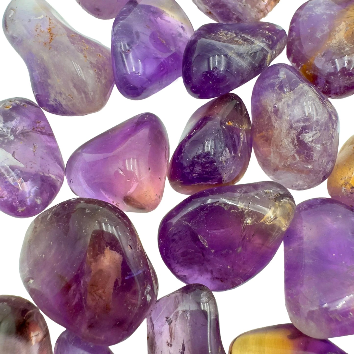Top view of Ametrine tumbled stone, showing natural sheen, carried for Focus.