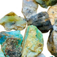Profile view of Blue Opal raw stone, showing natural color depth, associated with Emotional Healing.