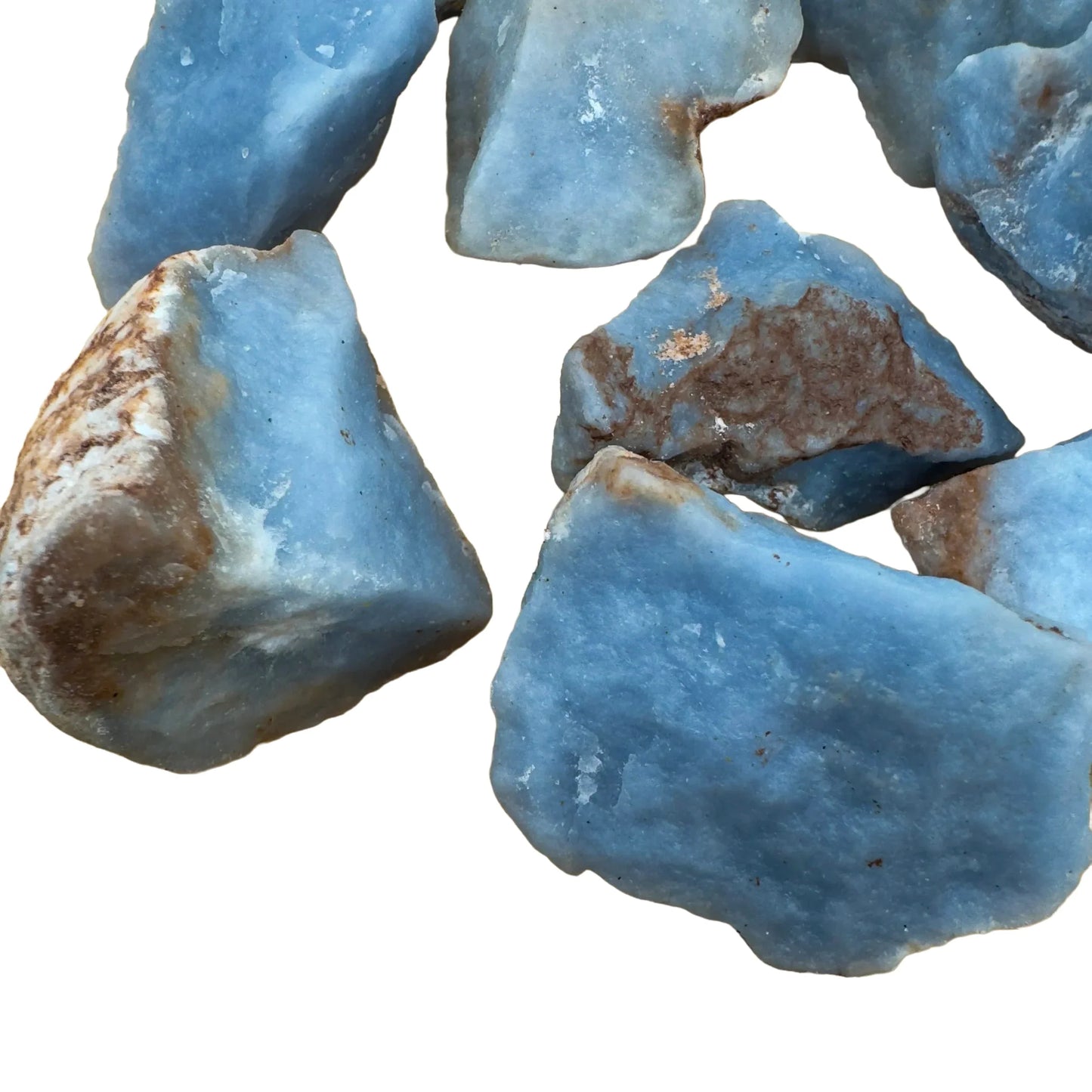 Side perspective of Grade A Angelite raw stone, associated with Stress Relief and Meditation, showing subtle veining.