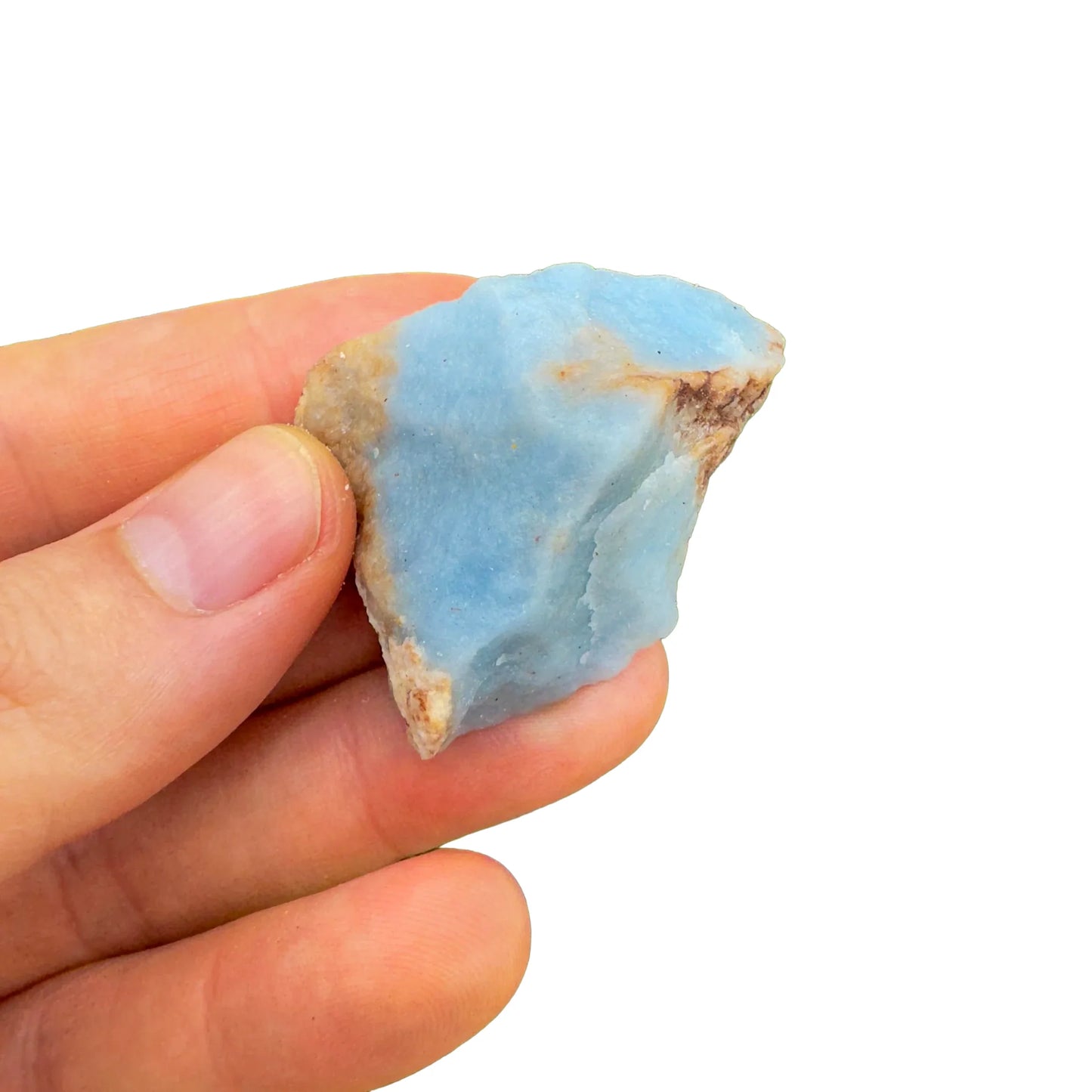 Overhead view of Angelite raw stone, showing honest grain, turned to for Stress Relief and Meditation.