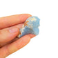 Grade a angelite raw held in hand for size reference